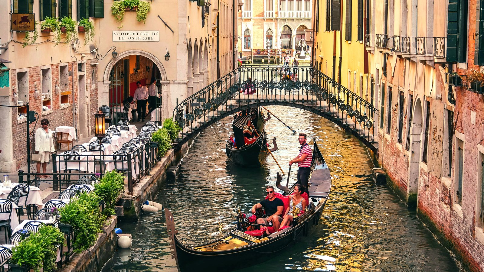 Romantic gondola ride through canals of Venice, Italy