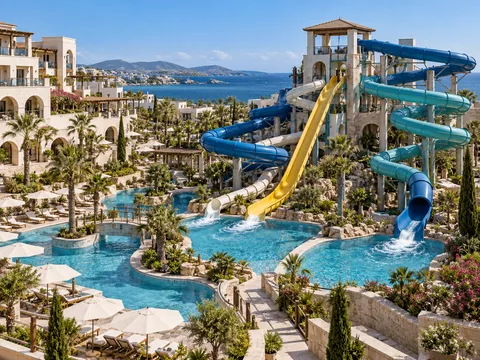Waterslides and splash pools at a fictional family hotel